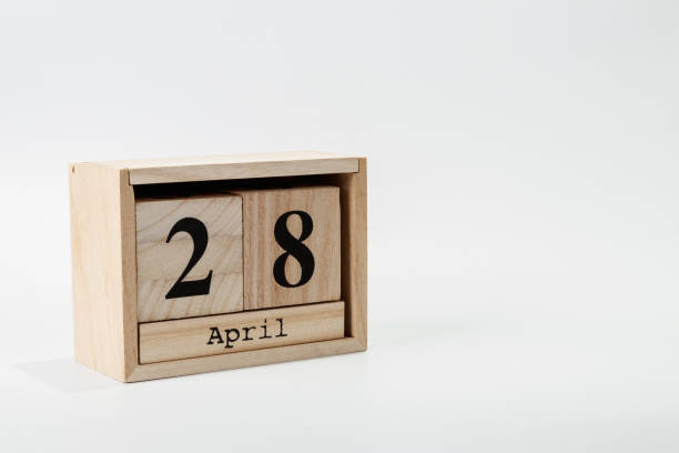 istock Wooden calendar April 28 on a white background 1128705227