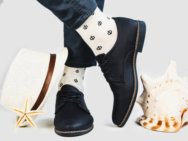 istock Men's legs, bright socks and stylish shoes 1128705320