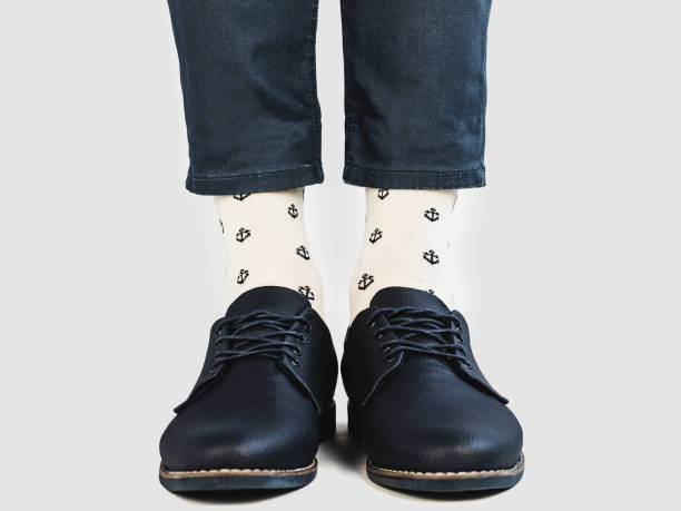 istock Men's legs, bright socks and stylish shoes 1128705481