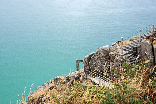 Porthcurno, Cornwall, England - July 24, 2018: A sunny day over looking the open air Minack Theatre, on the coast of Cornwall built by Rowena Cade