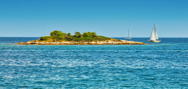 Small island in the sea, summertime background