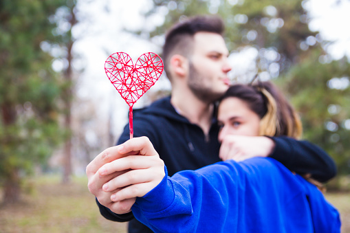 Couple holding heart