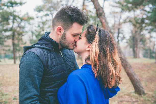 istock Young couple in park 1128708087