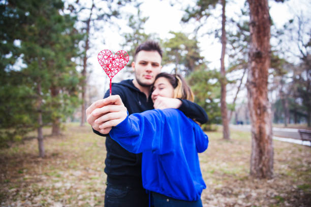istock Couple holding heart 1128708875