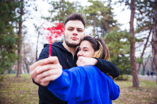 Couple holding red heart