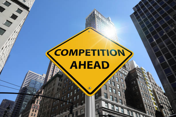 istock Business competition ahead warning sign financial district skyscrapers 1128711106