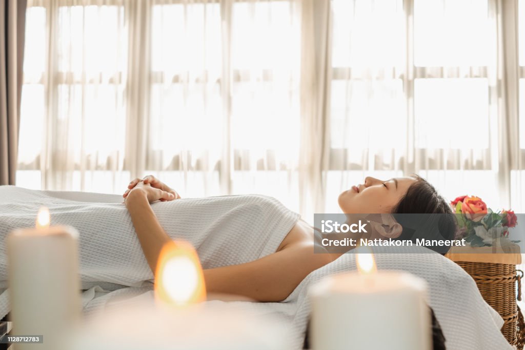 Young Asian beauty woman enjoying massage and spa Adult Stock Photo