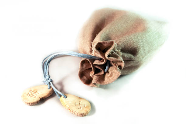 Set the runes fortunetelling in linen bag on a white background. Slavic, Scandinavian