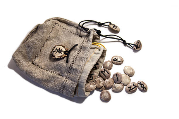 Set the runes fortunetelling in linen bag on a white background. Slavic, Scandinavian