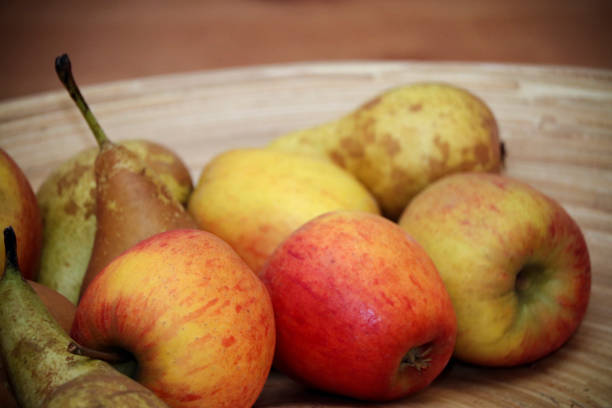istock Bowl of apples and pairs 1128717265