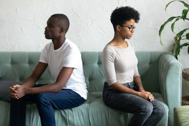 istock Couple not talking and looking at each other after quarrel 1128717763