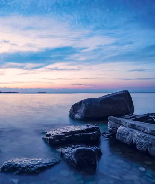 Rocky coastline sunset. Blue hour on Lake Michigan at Peninsula State Park, Door County, Wisconsin