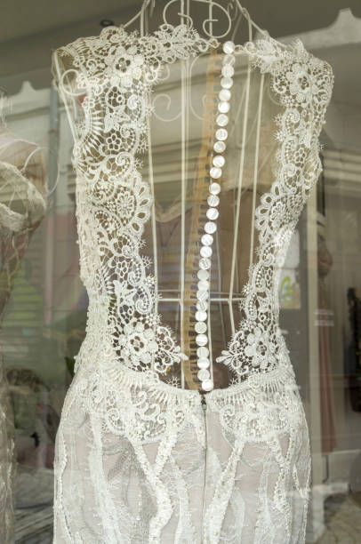 istock Back on lace dress on a mannequin in store 1128719389