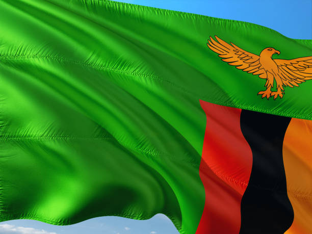 Flag of Zambia waving in the wind against deep blue sky. High quality fabric. Flag of Zambia waving in the wind against deep blue sky. High quality fabric. zambia flag stock pictures, royalty-free photos & images