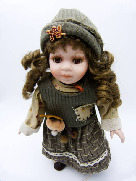 istock Ceramic old dolly with brown eyes on white background 1128725201