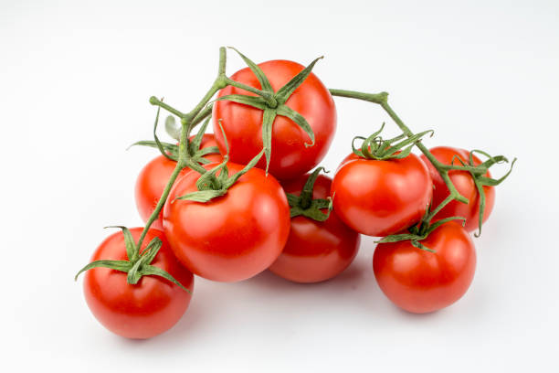 istock Fresh organic red tomatoes on the white background 1128725983