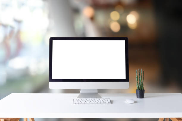 istock Mockup computer on office desk and cactus in office. 1128726800