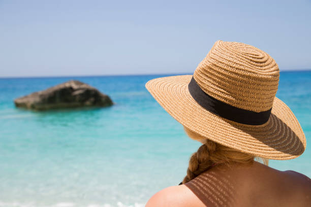 istock Young woman on the beach 1128726852