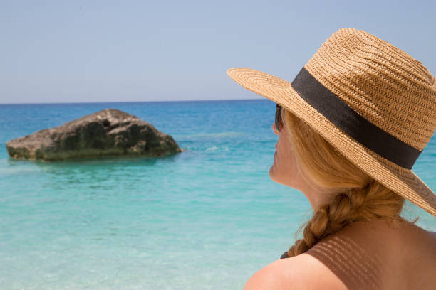 istock Young woman on the beach 1128727262