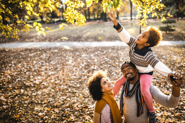 istock Look, I can reach tree leaves on daddy's back! 1128727518