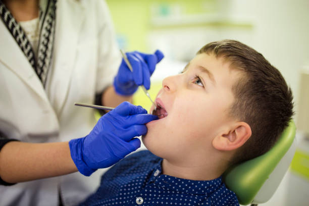 istock Little boy at regular dental check-up 1128730396
