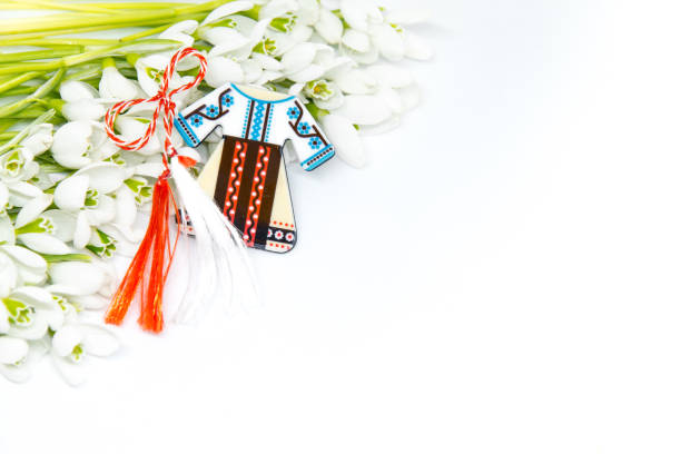 istock snowdrops flowers arranged on white background with copy space and first of march romanian bulgarian symbolic tradition 1128730841