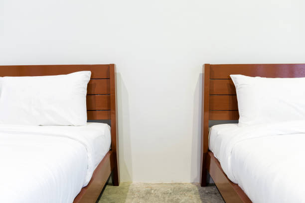 istock Twin bed in hotel room 1128732900