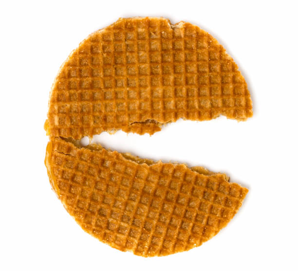 istock Half-broken Dutch cookie on a white. The view from the top. 1128734284