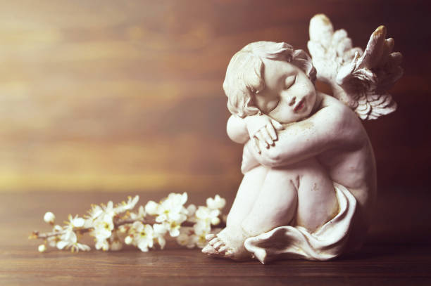 istock Guardian angel and spring branch 1128734546