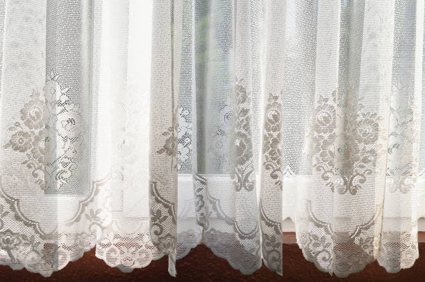 istock Lace curtain on the window 1128734572