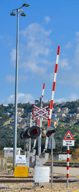 Railway crossing with signs on the rail road stock photo