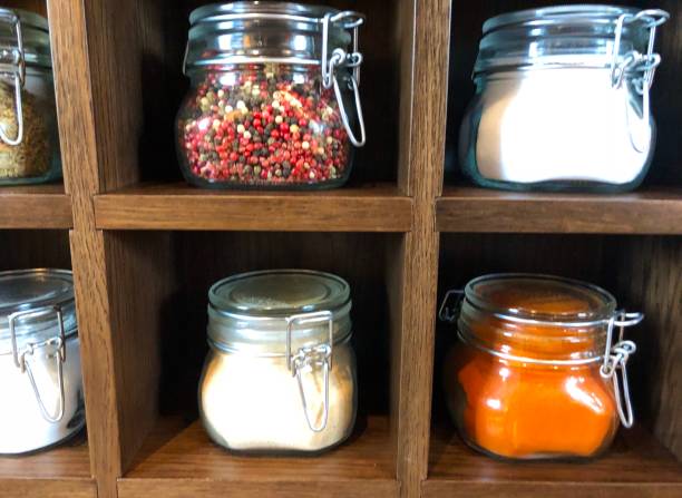 istock Large spice jars displayed in wooden case 1128740344