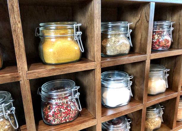 istock Large spice jars displayed in wooden case 1128740351