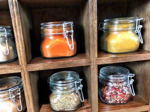 istock Large spice jars displayed in wooden case 1128740419