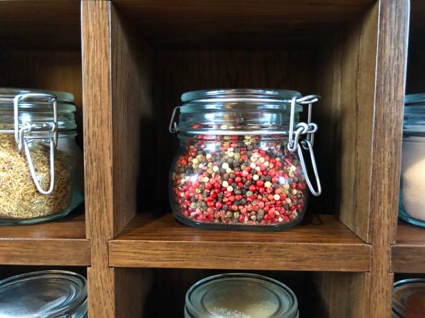 istock Large spice jars displayed in wooden case 1128740420