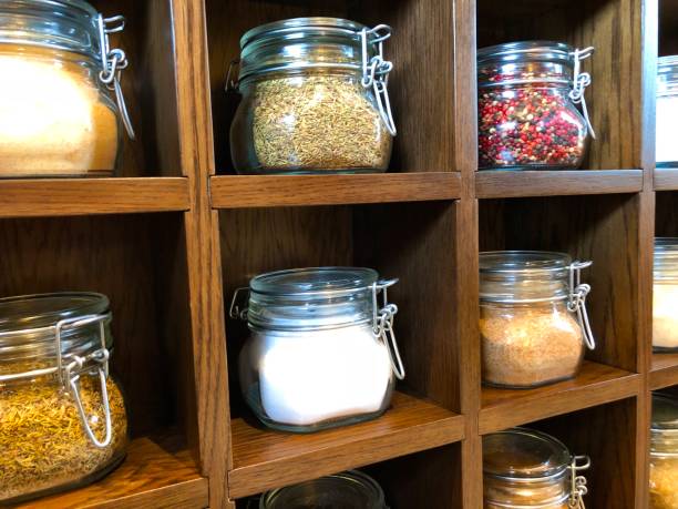 istock Large spice jars displayed in wooden case 1128740422