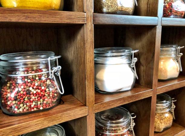 istock Large spice jars displayed in wooden case 1128740544