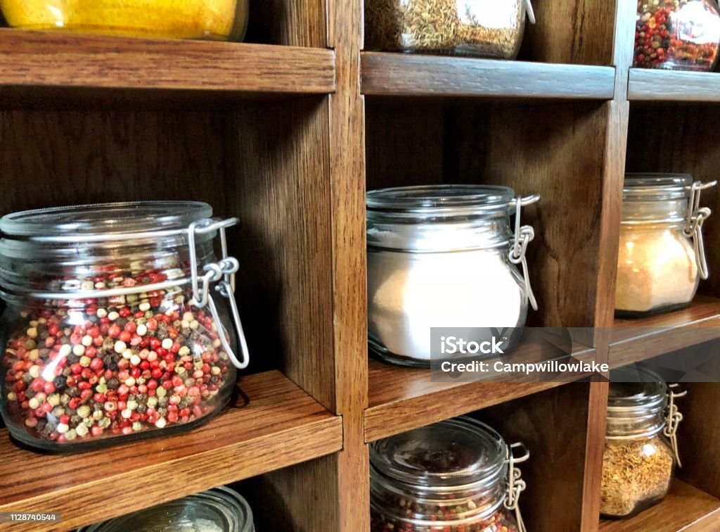 Large Spice Jars Displayed In Wooden Case Stock Photo - Download