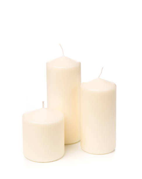 istock White candle on white background isolated. Set of wax candle. 1128742214