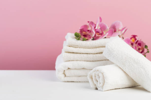 istock Spa still life with aromatic candles, flower and towel. - Image 1128747462