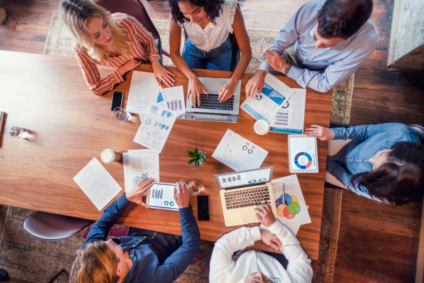 istock Group of people meeting with technology. 1128748779