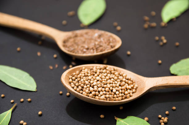 istock wooden spoons with pepper and flax seeds top view 1128748875