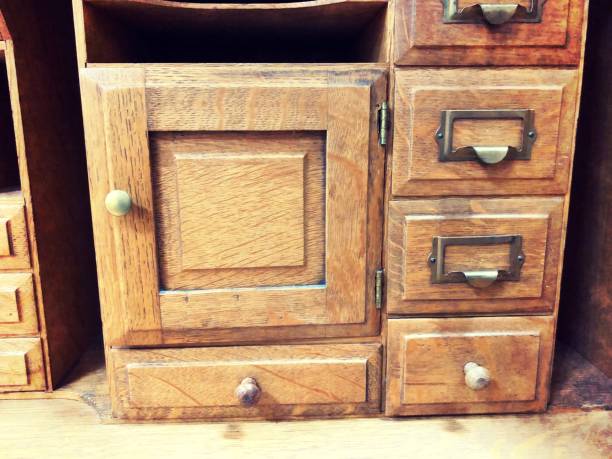 istock Vintage wooden filing cabinet - drawers with brass pull and wooden knobs 1128749212