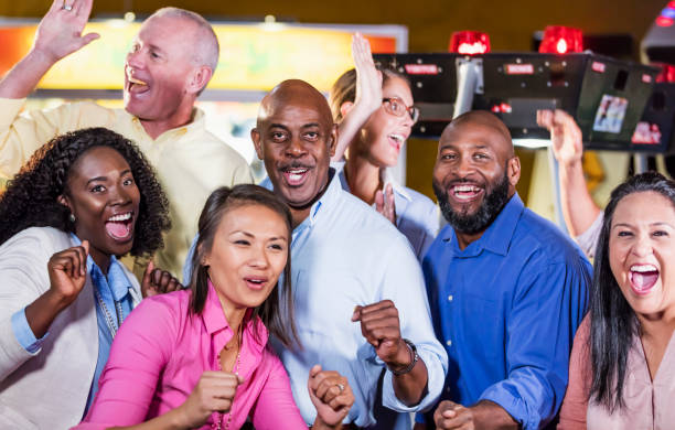 istock Corporate team building at amusement arcade 1128750288