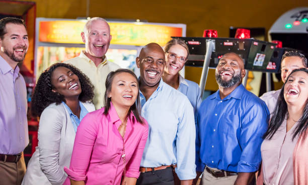 istock Corporate team building at amusement arcade 1128750291