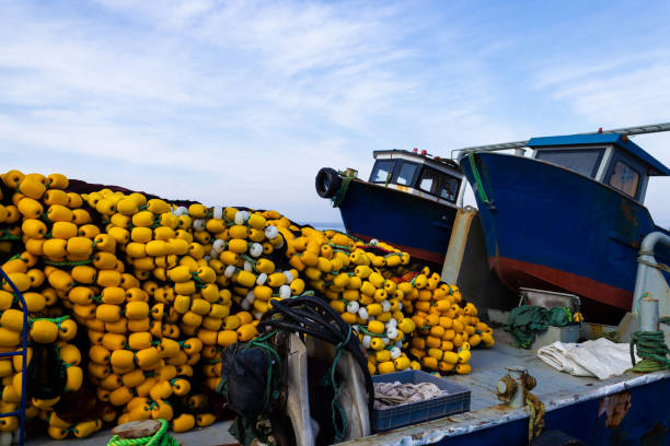 istock Fishing net stack on the fishing boat 1128750379