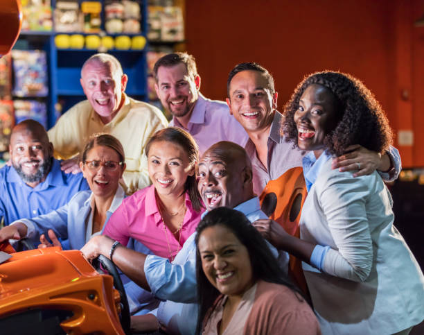 istock Corporate team building at amusement arcade 1128750566