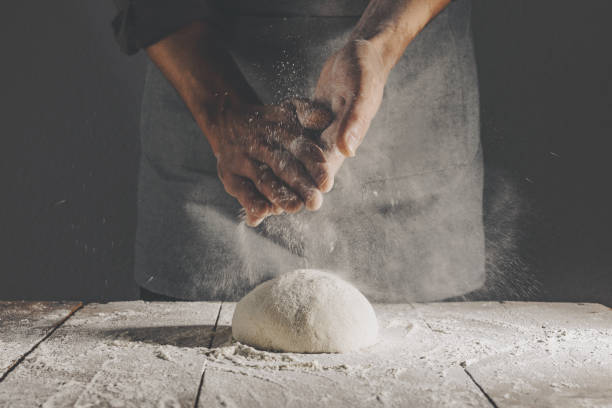 chef making fresh dough for baking - chef baker bakery flour imagens e fotografias de stock