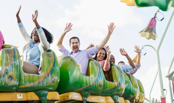 istock Corporate team building on amusement park rollercoaster 1128751863
