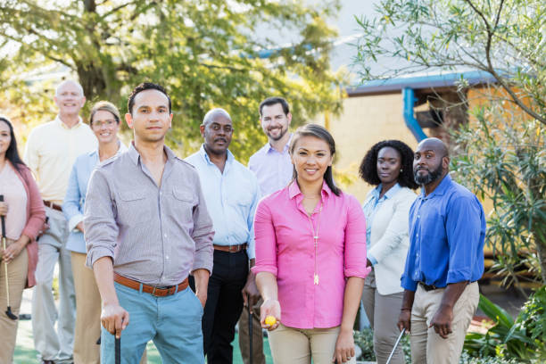 istock Corporate team building, playing miniature golf 1128752237